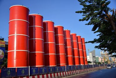 Low angle view of factory against blue sky