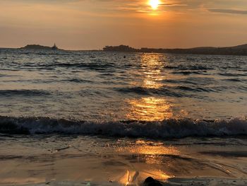 Scenic view of sea against sky during sunset