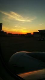 Cars on road at sunset