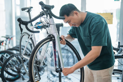 Man repairing bicycle