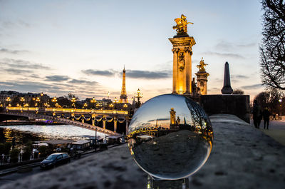 Buildings against sky during sunset in city