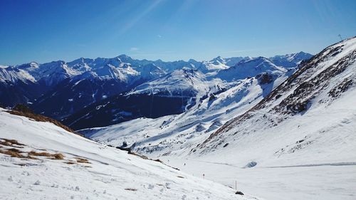 Scenic view of snowcapped mountains against sky