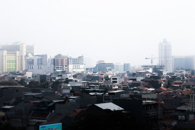 Cityscape against clear sky