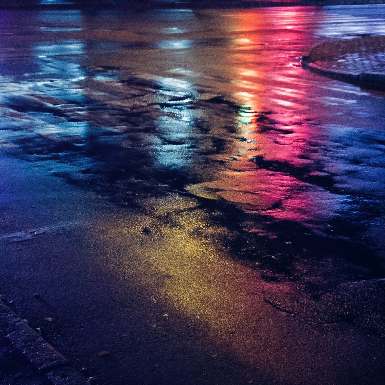 HIGH ANGLE VIEW OF WET STREET DURING MONSOON