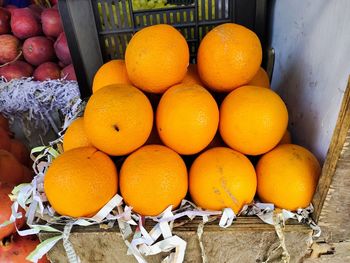 High angle view of oranges in crate at market