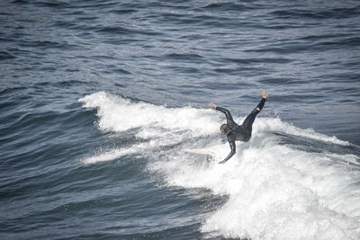 High angle view of man surfing in sea