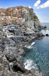 Scenic view of beach and buildings against sky