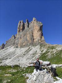 Scenic view of mountains against clear blue sky