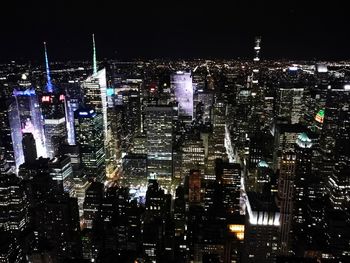 Illuminated modern buildings in city at night