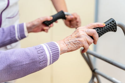 Cropped image of man holding hands