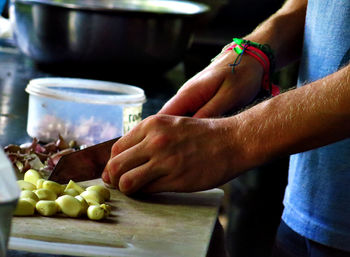Midsection of man preparing food