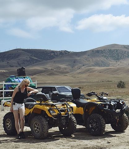 transportation, mode of transportation, sky, environment, land vehicle, landscape, land, nature, day, real people, mountain, cloud - sky, road, one person, travel, men, sunlight, off-road vehicle, outdoors, desert