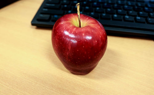 Fresh red apples on the computer. apple contains many vitamins