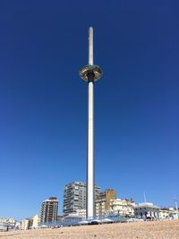 Low angle view of buildings against blue sky