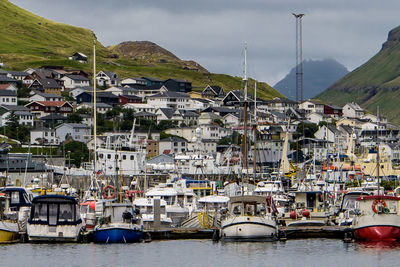 Boats moored at harbor