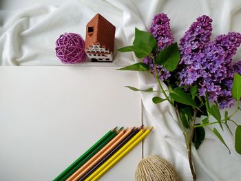 A white sheet of paper for drawing with colored pencils on it. flatlay