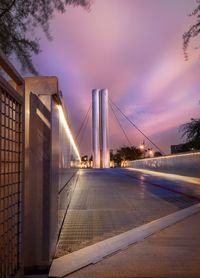 View of suspension bridge against cloudy sky