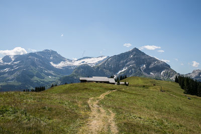 Scenic view of snowcapped mountains against sky