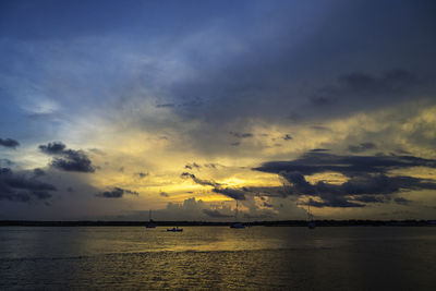 Scenic view of sea against sky at sunset