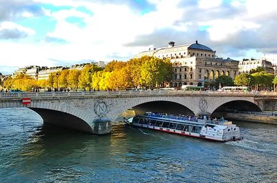 Bridge over river with buildings in background