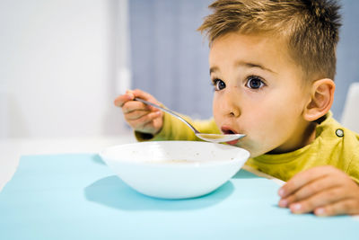 Portrait of boy eating food