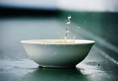 Close-up of water splashing in container