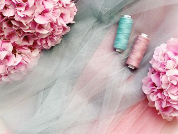 High angle view of pink flower on table