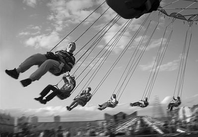 Low angle view of carousel against sky