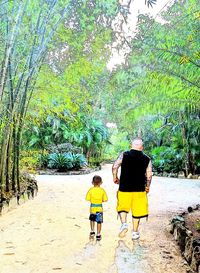 People standing on tree trunk