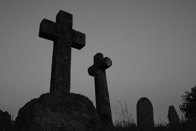 Low angle view of cross against clear sky