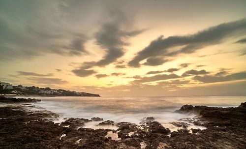 Scenic view of sea against sky during sunset