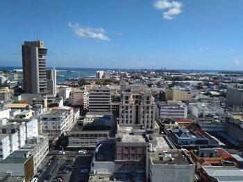 High angle view of buildings in city against sky