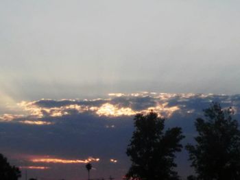 Scenic view of landscape against cloudy sky