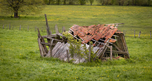 Abandoned empty bench on field