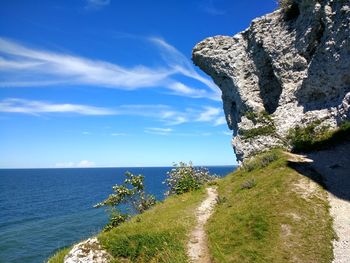 Scenic view of sea against blue sky