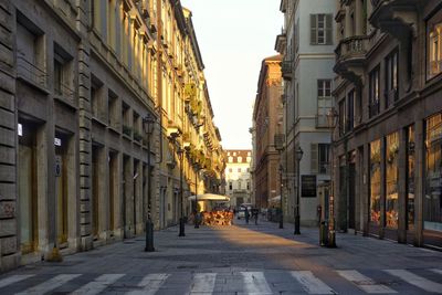 Street amidst buildings in city against sky