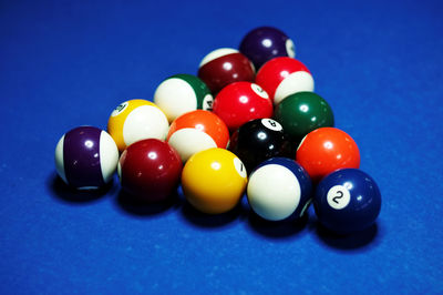 Close-up of pool balls arranged on table