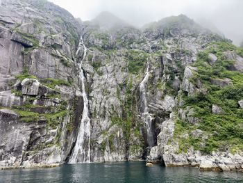Scenic view of sea against mountain