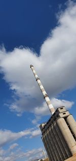 Low angle view of crane against sky