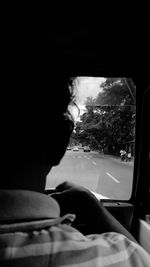 Woman looking through airplane window