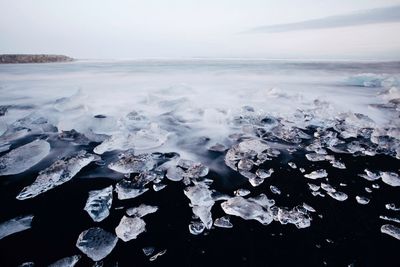 Scenic view of frozen sea against sky