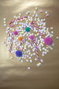 High angle view of multi colored candies on table