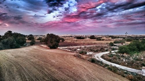 Dirt road passing through landscape