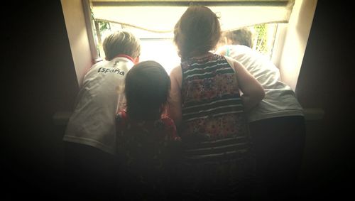 Friends standing on table