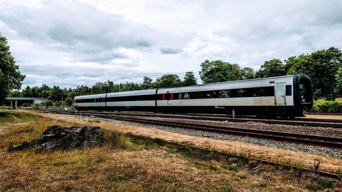 Train on railroad track against sky