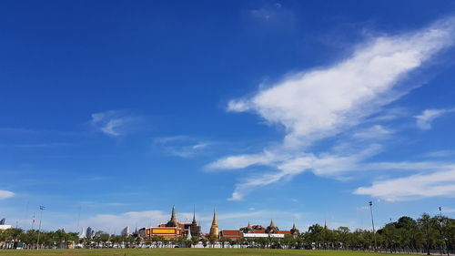 View of buildings against blue sky