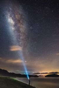 Scenic view of star field against sky at night