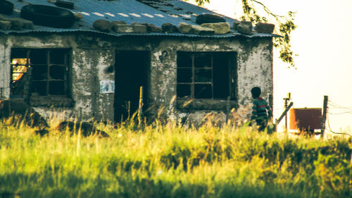 Abandoned house on field