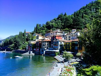 Built structures against clear blue sky