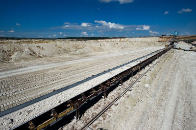 Conveyor belt at mining industry on sunny day